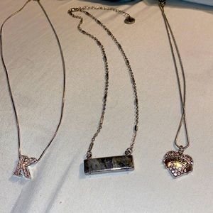 3 silver colored necklaces